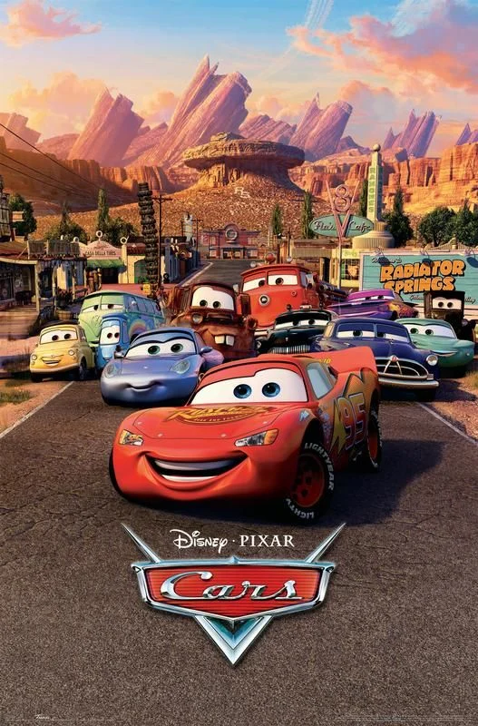 Cars poster with a smiling red race car and other animated vehicles in a desert town.